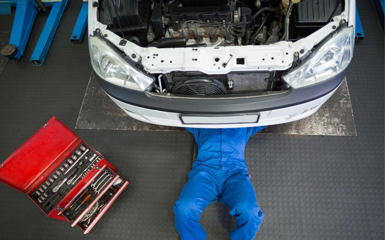mechanic-working-under-car